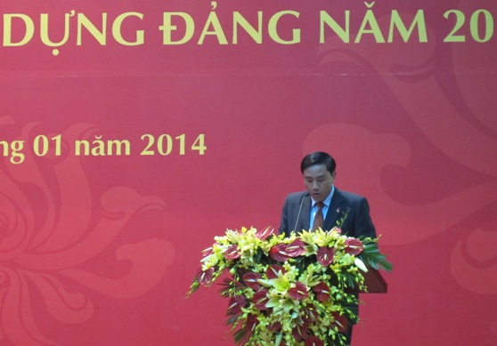 Đồng chí Hoàng Giang - Trưởng ban Dân vận Đảng ủy Khối DNTW báo cáo công tác dân vận năm 2013 tại Hội nghị